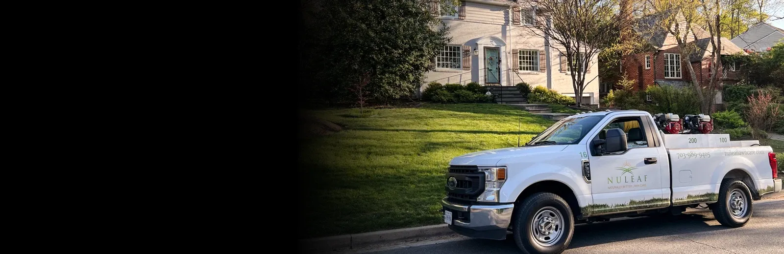 NuLeaf Lawn Care truck in front of house